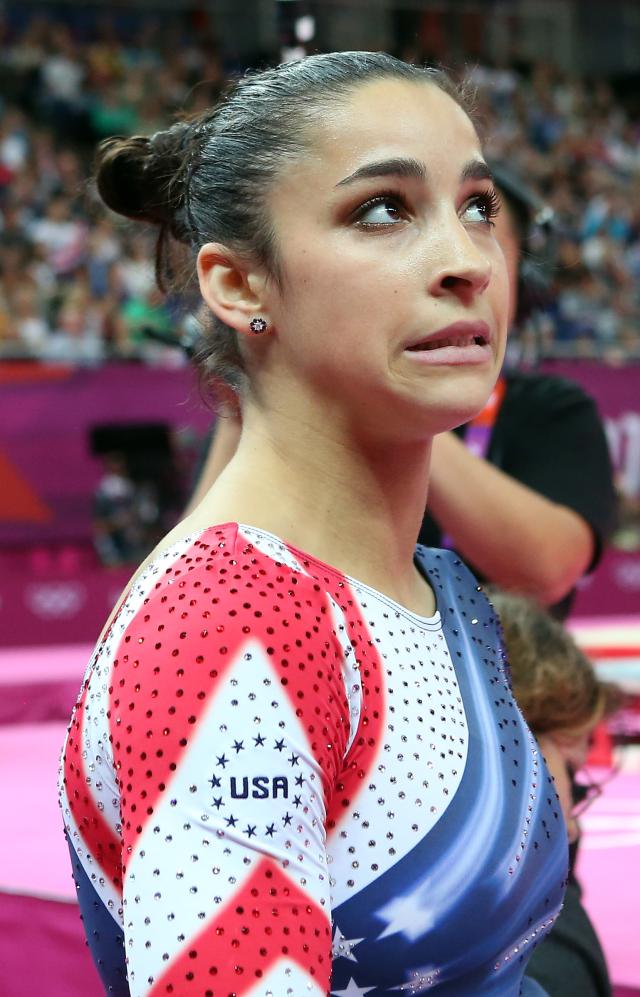 LONDON, ENGLAND - AUGUST 07: Alexandra Raisman of the United States reacts after she competes on the beam during the Artistic Gymnastics Women's Beam final on Day 11 of the London 2012 Olympic Games at North Greenwich Arena on August 7, 2012 in London, England. (Photo by Ronald Martinez/Getty Images)