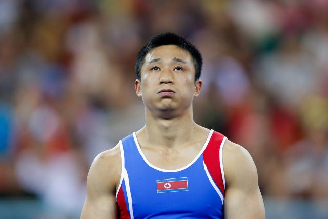 NANNING, CHINA - OCTOBER 12: Gold medalist Gwang Ri Se of North Korea celebrates during the medal ceremony after Men's Vault Final on day six of the 45th Artistic Gymnastics World Championships at Guangxi Sports Center Stadium on October 12, 2014 in Nanning, China. (Photo by Lintao Zhang/Getty Images)