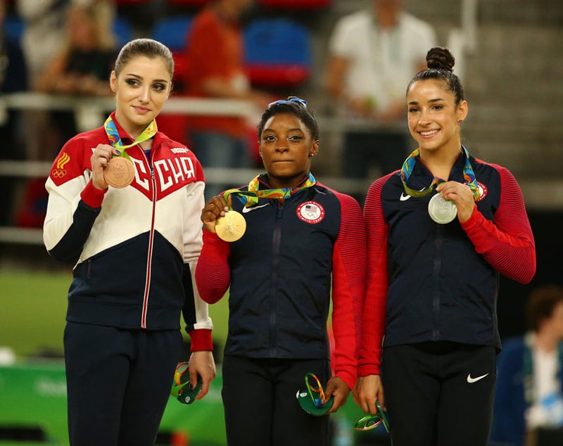 RIO DE JANEIRO, BRAZIL -AUGUST 11, 2016:Women's all-around gymnastics medalists at Rio 2016 Olympic Games Aliya Mustafina of Russia (L),Simone Biles of USA and Aly Raisman of USA during medal ceremony — Photo by zhukovsky
